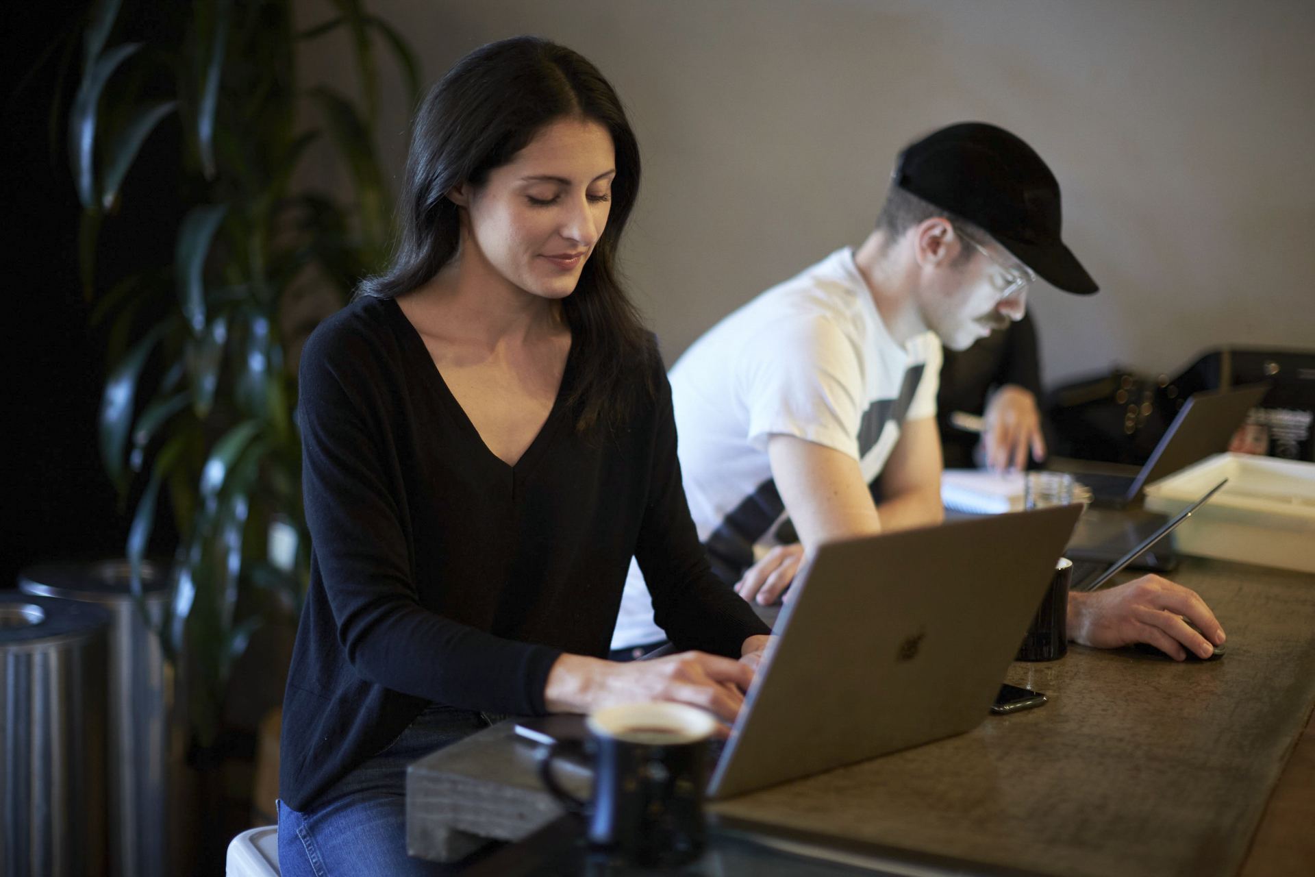 Woman working on a laptop in a cafe